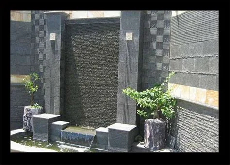 desain tembok depan rumah batu alam