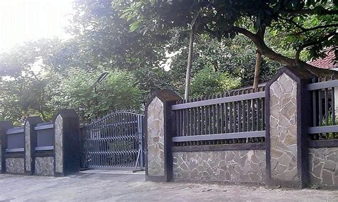 desain pagar besi minimalis batu alam terbaru